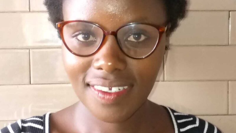 Image of the author Mary Wanjiru Njuki smiling.